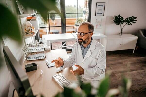 Doctor Working On Computer600