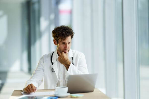 Doctor Working on Computer 600